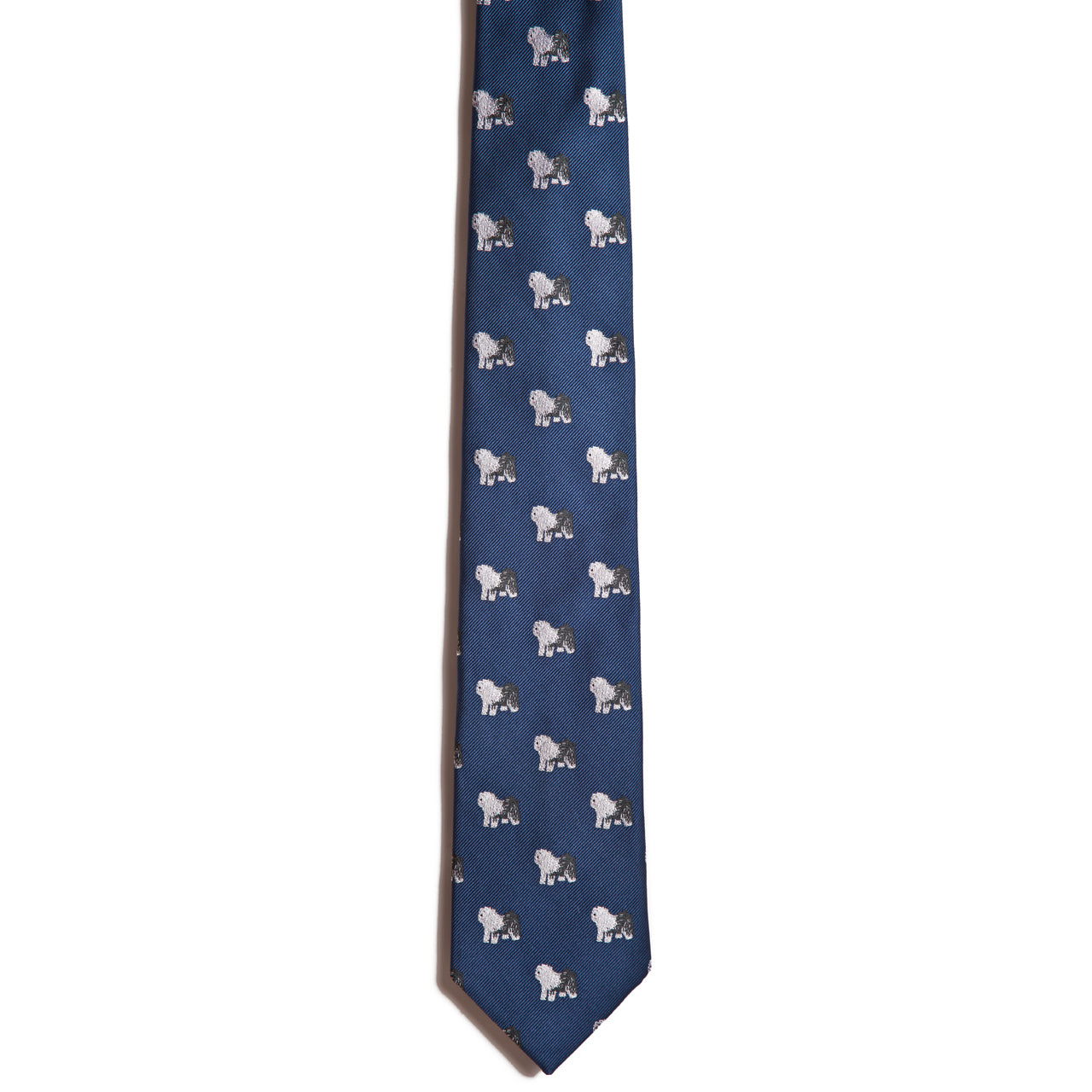 An Alden Madison Old English Sheepdog silk jacquard necktie featuring a repeating pattern of small embroidered Old English Sheepdogs.