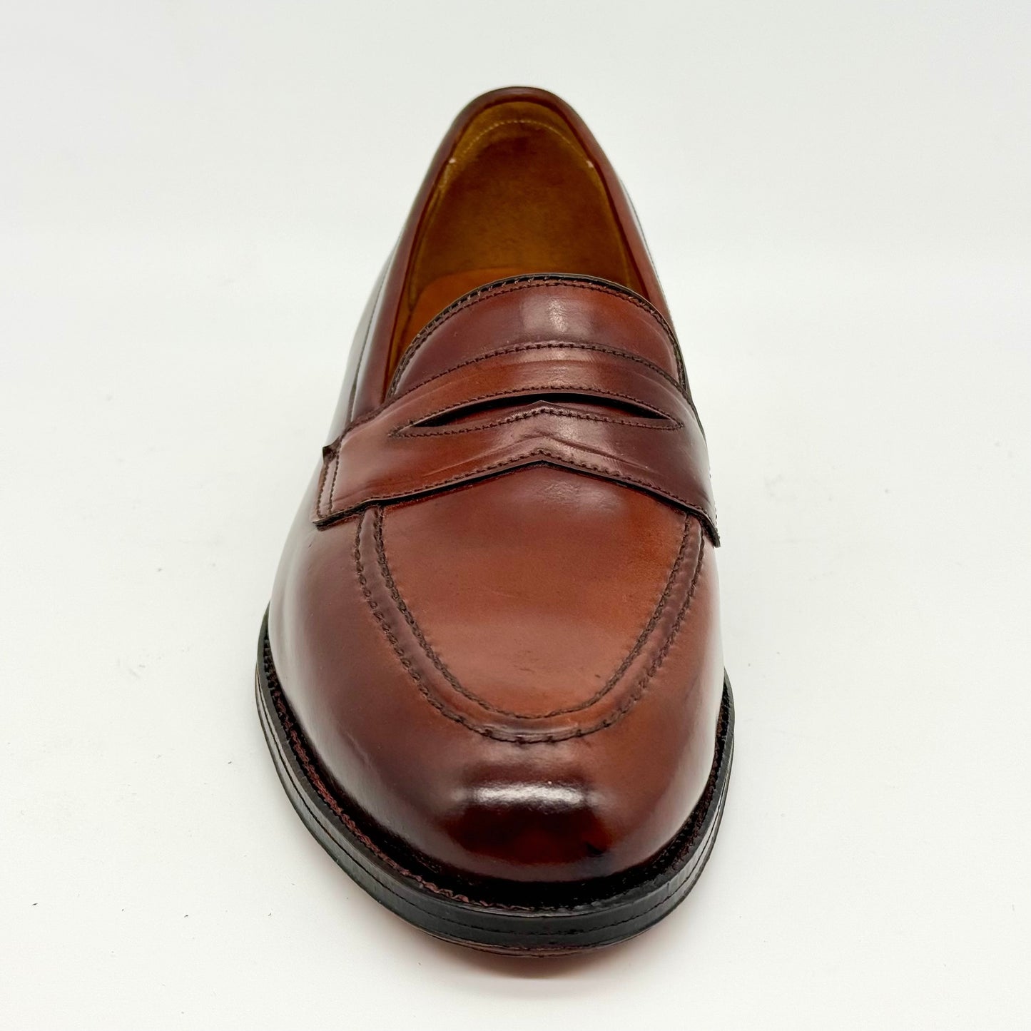 The ALDEN SHOES 5750 - Higher Vamp "Midtown" Slip On in Color 8 features a sleek design with a black sole, expertly crafted for comfort and style.