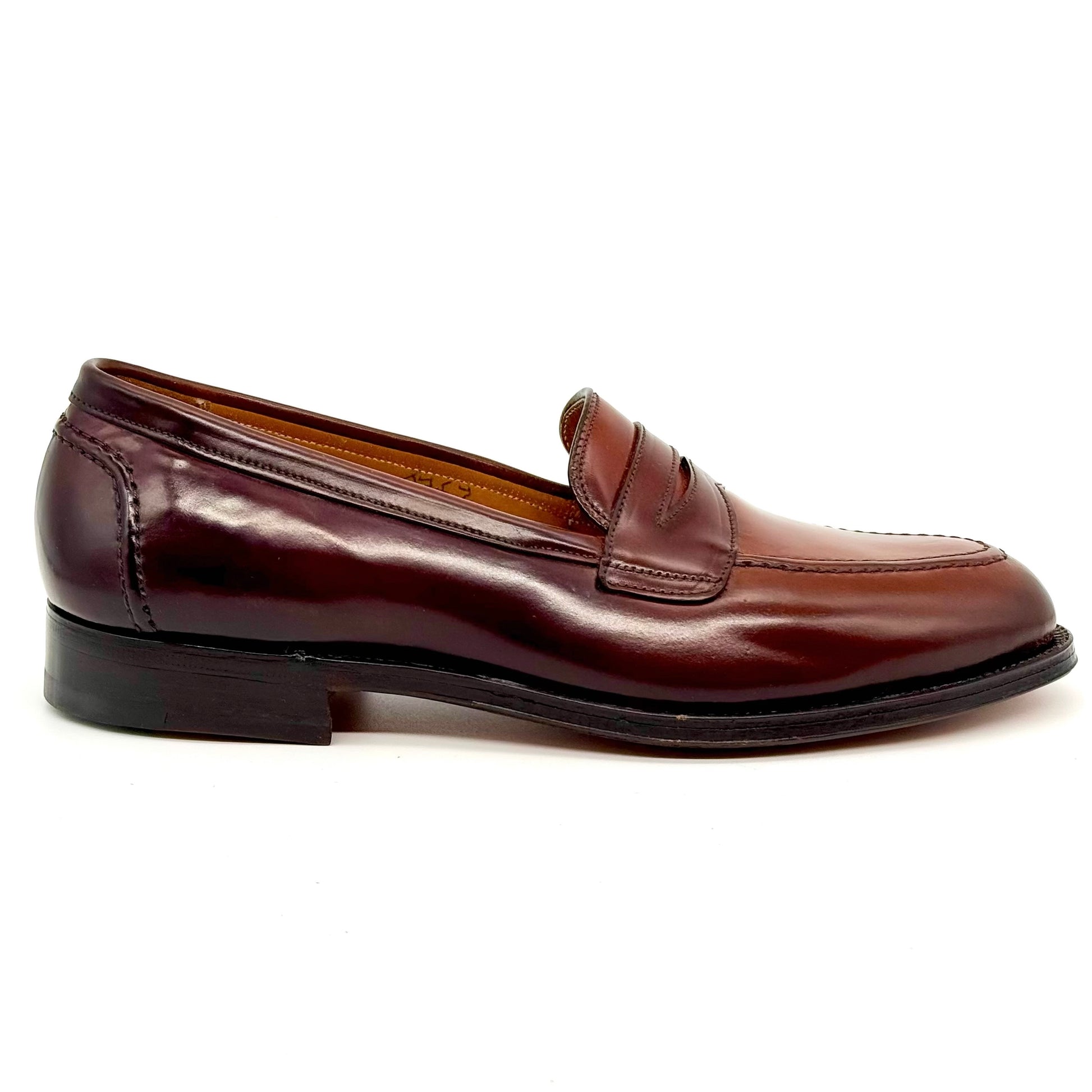 The ALDEN SHOES 5750 - Higher Vamp "Midtown" Slip On in Color 8 is a loafer featuring a penny strap, low heel, stitching details, and is crafted on the Aberdeen Last, shown against a plain white background.
