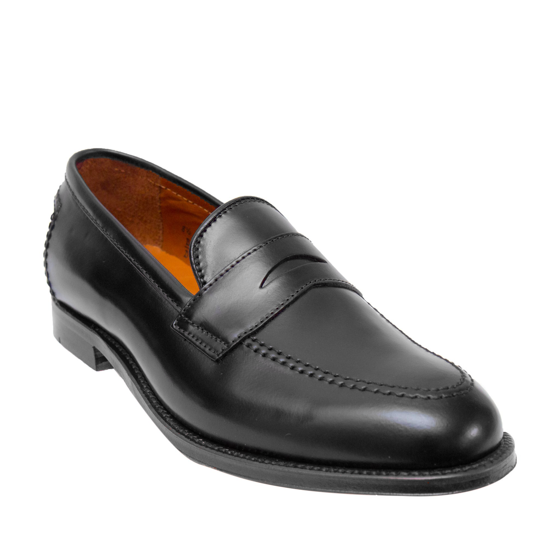 The Alden Madison D2221 - Madison Penny in Black Shell Cordovan is a classic black loafer on the Leydon Last, featuring a polished finish, low heel, moc toe stitching, penny slot vamp, brown lining, and smooth shell leather.