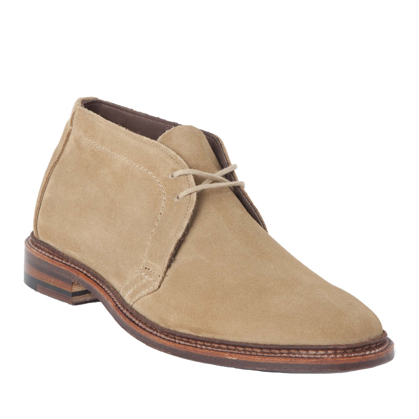 The Alden Madison 1494 Unlined Chukka in Tan Suede features a classic design on the Leydon Last with brown leather trim and sole, minimal lacing, and clean stitching. A slight heel accentuates its style against a white backdrop.