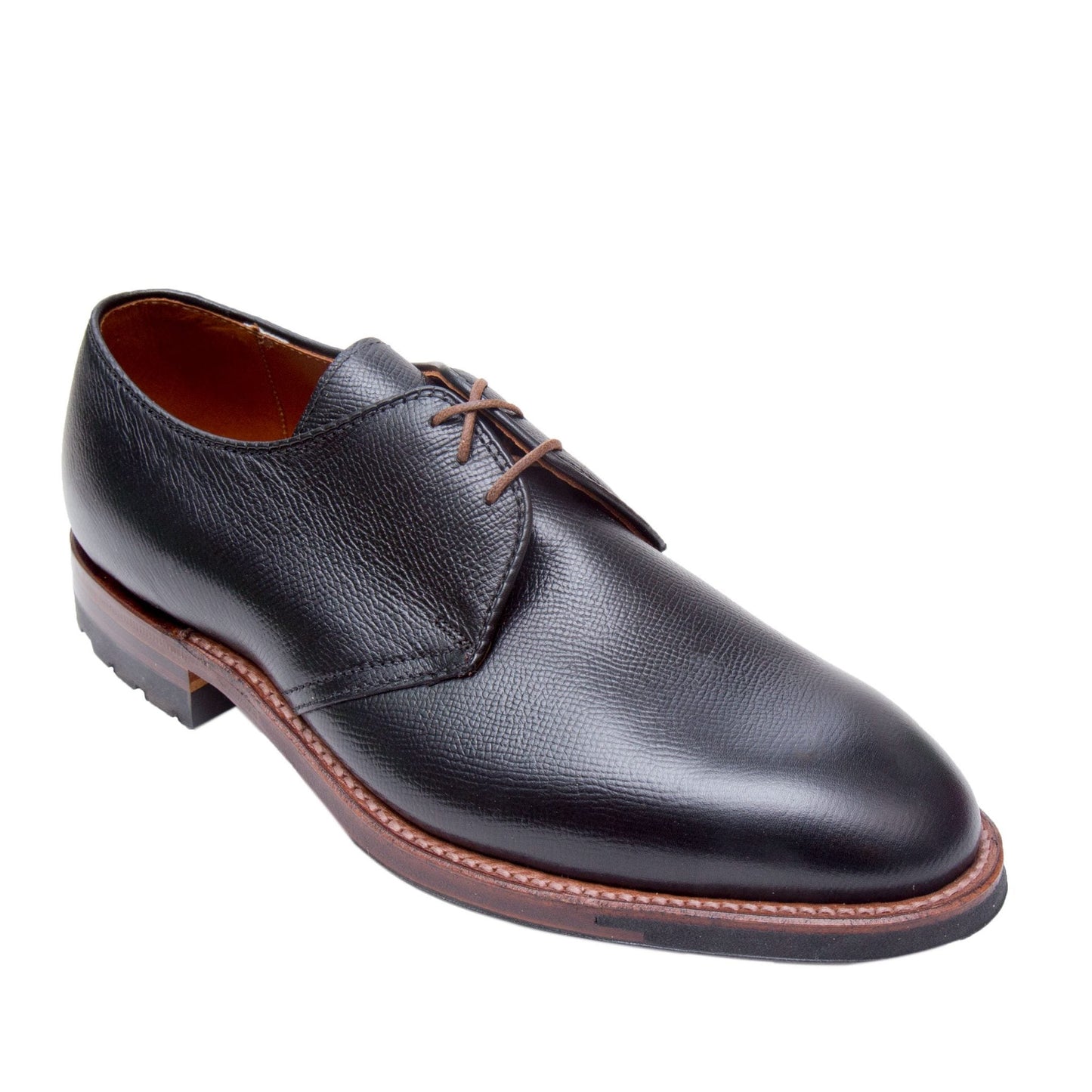 The Alden Madison 940C - 3 Eye Dutton shoe, made from Black Alpine Grain Calfskin, features brown laces and a Commando Sole. This classic lace-up design is crafted on the Hampton Last, offering comfort and timeless elegance against a white background.