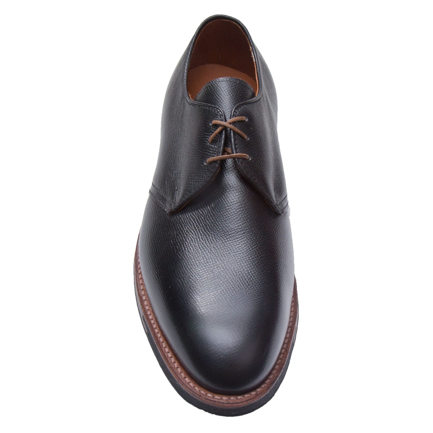 The 940C - 3 Eye Dutton by Alden Madison is a single black leather dress shoe crafted from Black Alpine Grain Calfskin, featuring brown laces and stitching. Its built on the Hampton Last with a slightly rounded toe, Commando Sole, and light brown interior.