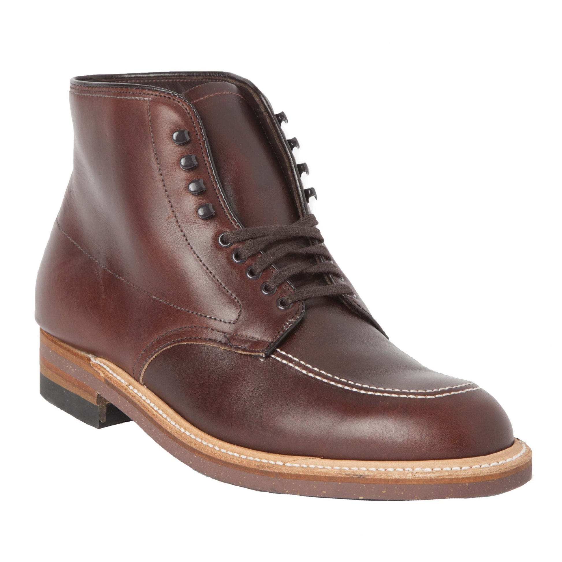 The Alden Madison 403 - Indy Boot in Brown Chromexcel is a single leather boot with a round toe and lace-up design featuring speed hooks for quick fastening. It has a contrasting tan cork sole, black heel, visible stitching, and a slight sheen for a polished look.