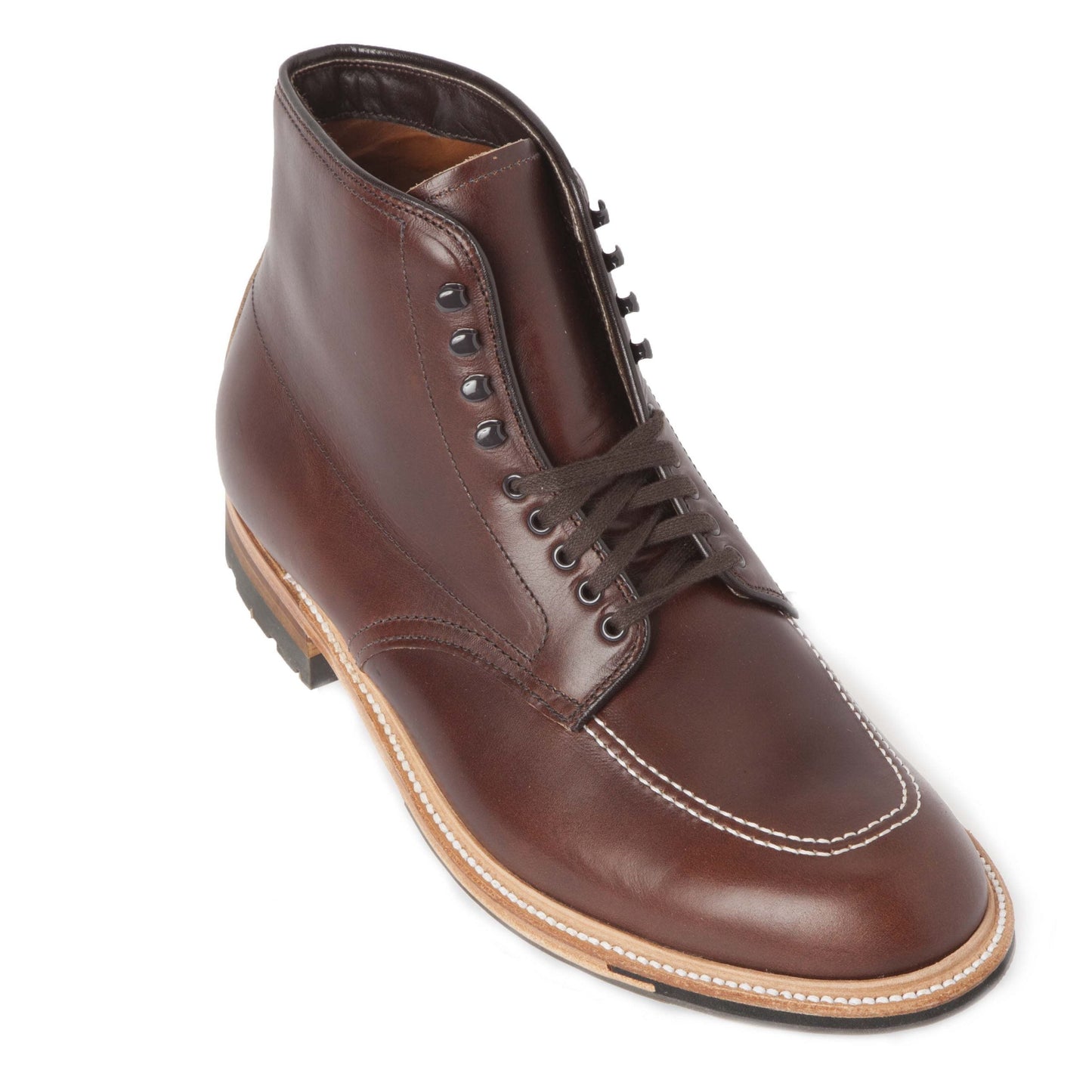 The Alden Madison 403C - Indy Boot in CXL is a brown leather boot with black metal eyelets and laces, tan stitching around the toe, and a light brown Commando Sole with a black rubber heel. It is angled to show both the front and side.