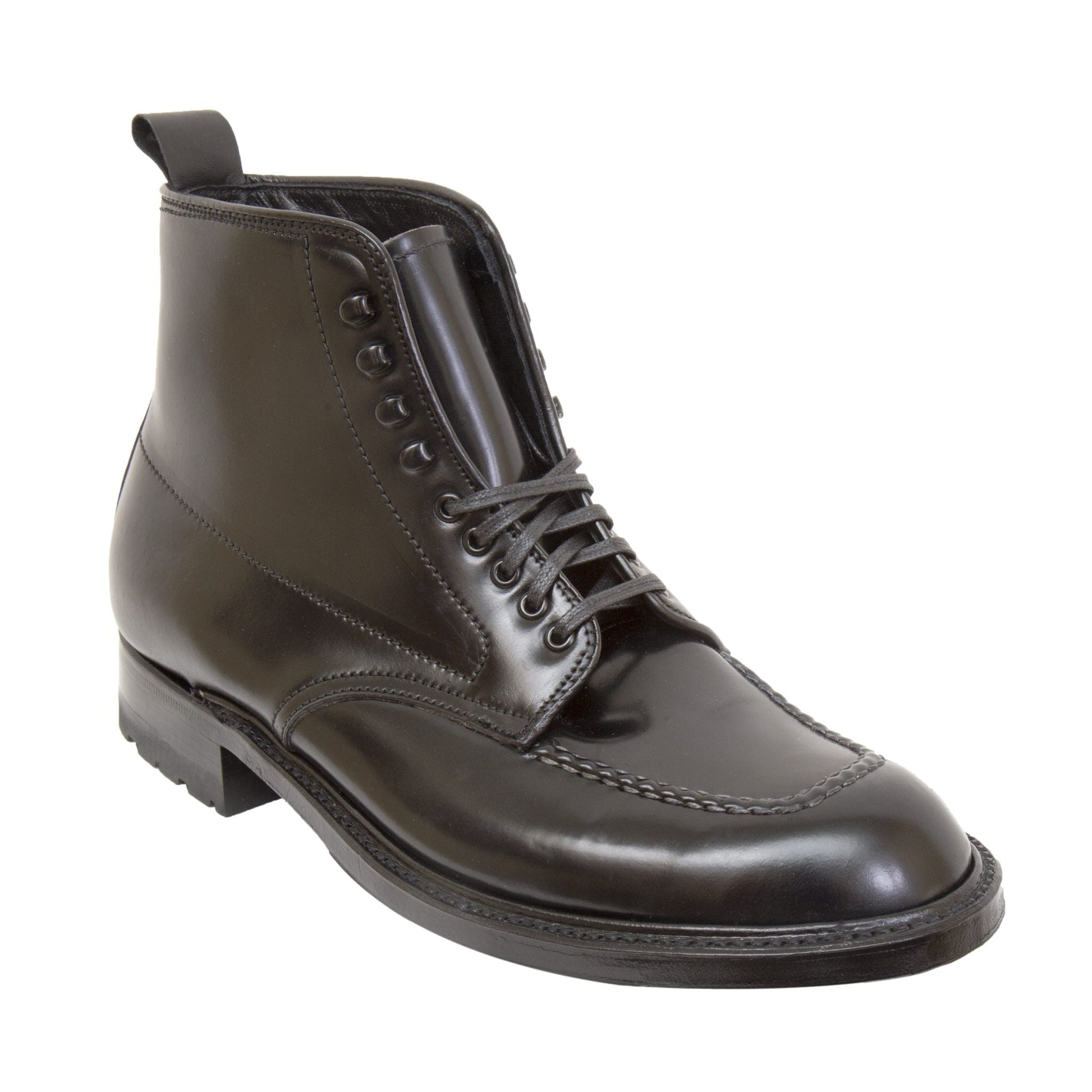 The Alden Madison 40509HC - Indy Boot w Commando Black Shell is a polished black leather ankle boot crafted from Black Shell Cordovan, with black laces, detailed stitching, a pull tab, and a sturdy Commando sole, all set against a white background.