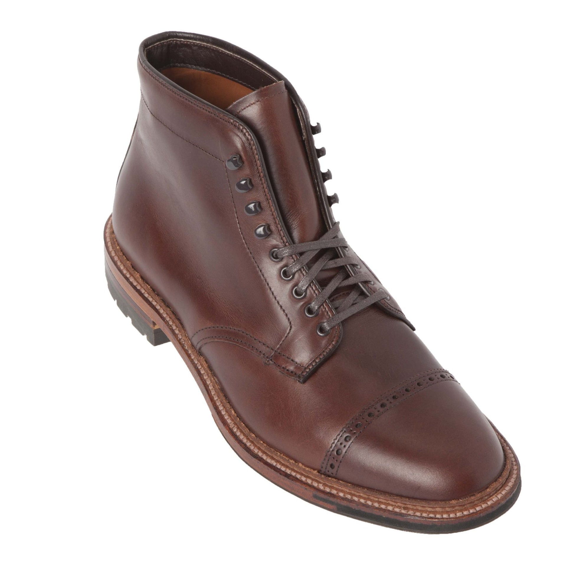 The Alden Madison 44924HC Jumper Boot in Brown Chromexcel is a cap toe dress boot featuring partial lacing, metal eyelets, speed hooks, and a sturdy sole, shown at a slight angle.