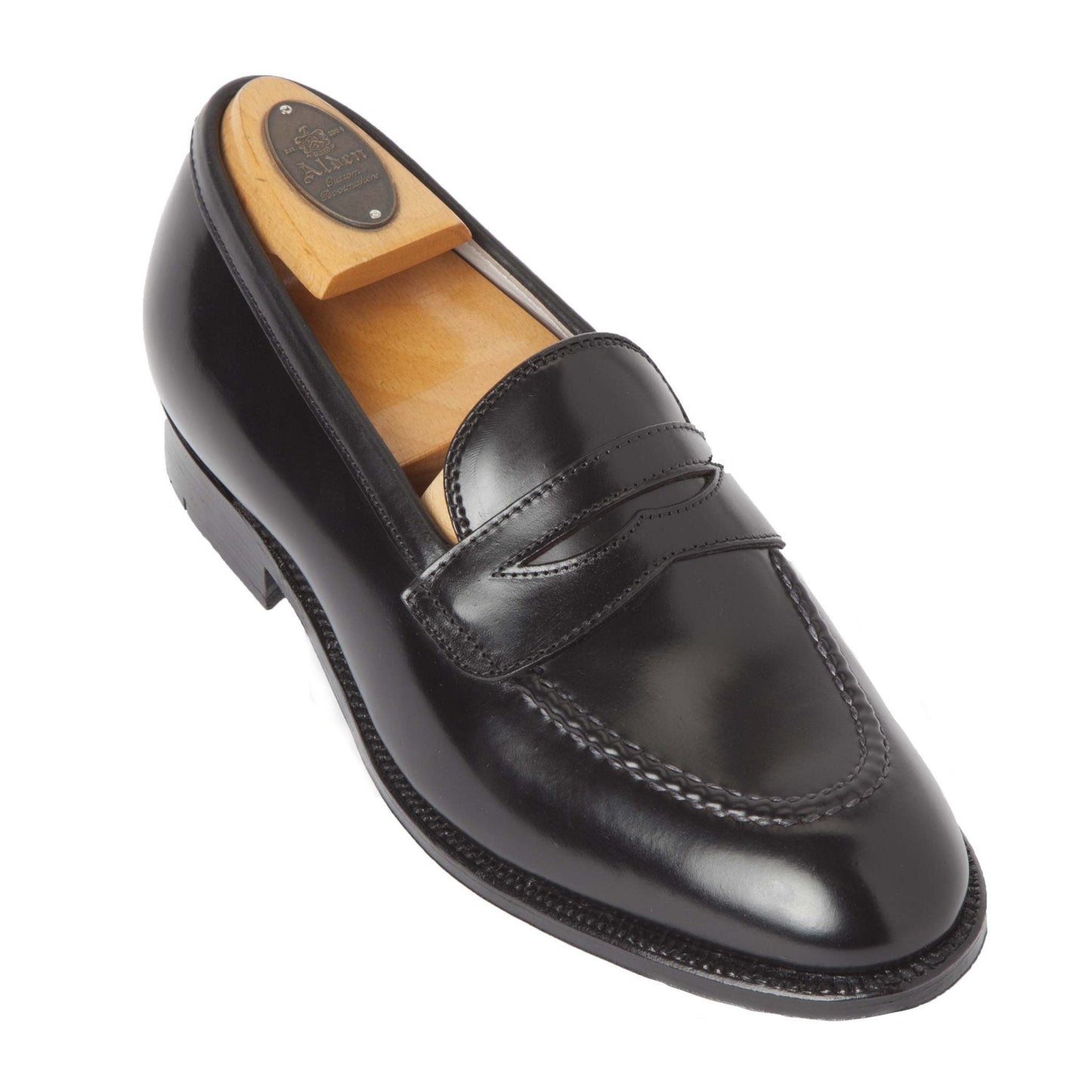 The Alden Madison 67269 High Vamp Loafer in Black Shell Cordovan with a Single Oak Leather Sole and wooden shoe tree is displayed on a white background.