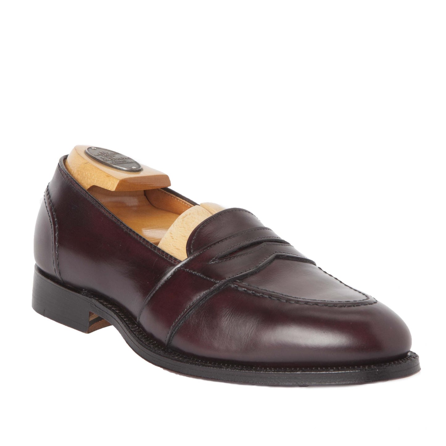 Alden Madison 683 - Full Strap Loafer in Burgundy Calfskin, featuring a leather sole and wooden shoe tree, displayed on a white background.