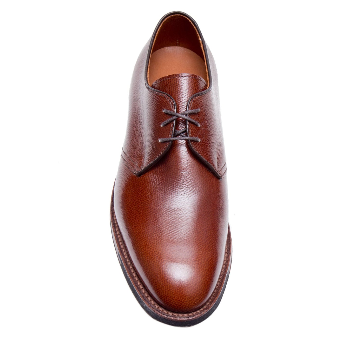 A single Alden Madison 942C - 3 Eye Dutton in Brown Alpine Grain, featuring textured calfskin, brown laces, and a rounded toe on the Hampton Last, is viewed from above on a white background.