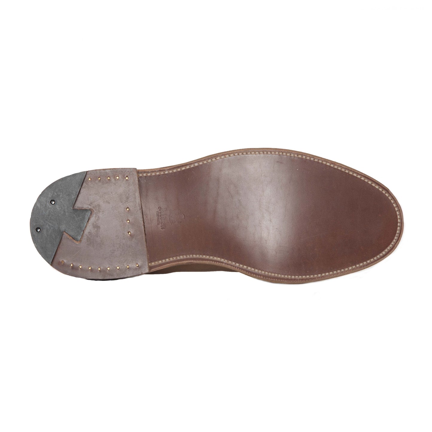 A close-up of the Alden Madison 9693F Flex Penny Loafer in Snuff Suede displays edge stitching, a flex leather sole with leather midsection, metal heel studs, and a gray rubber heel cap.