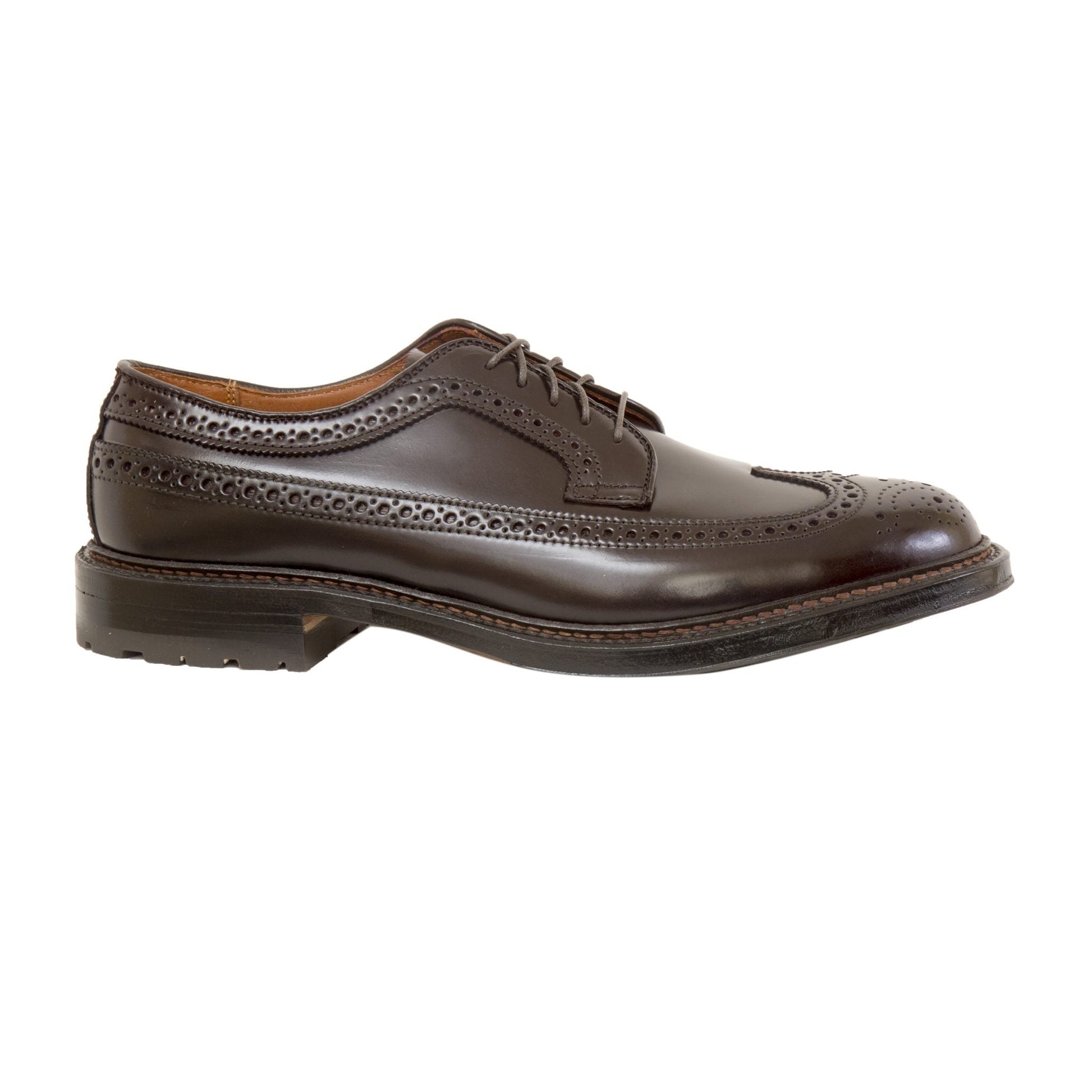 The 975C - Long Wing w Commando Sole in Color 8 Shell Cordovan by Alden Madison is a single dark brown leather wingtip dress shoe with brogue detailing, lace-up closure, and a textured rubber sole, shown on a white background.