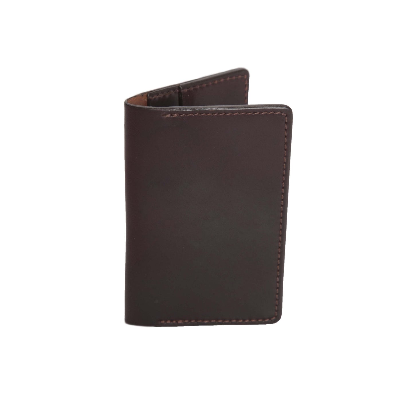 The Alden Madison Credit Card Wallet in Shell Cordovan, a closed dark brown leather wallet, stands upright on a white background. It highlights its smooth texture, edge stitching, and a sleek single-fold design featuring 4 slots.