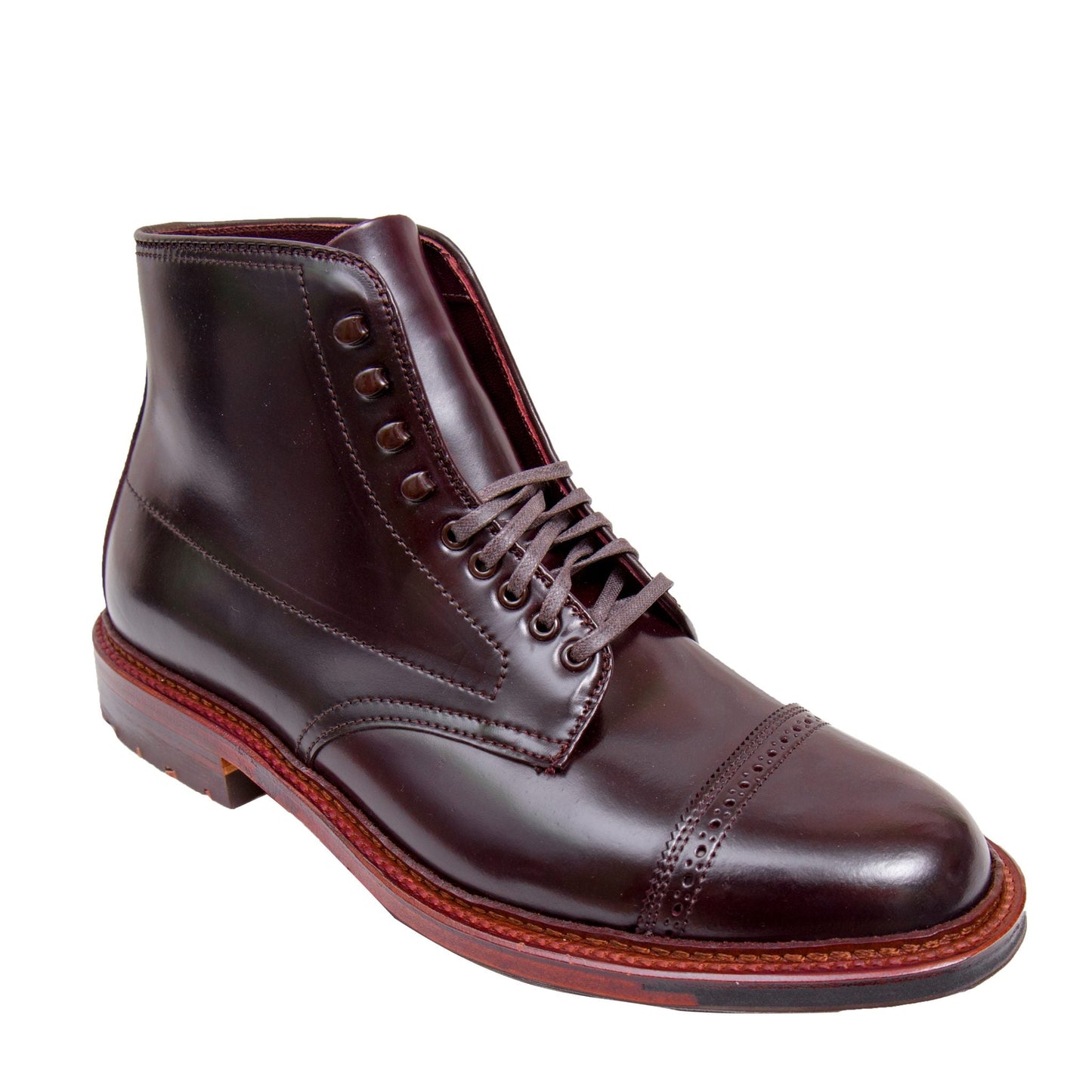 The Alden Madison D6861HC Jumper Boot in Color 8 Shell Cordovan is a polished, dark brown leather boot with laces, crafted on the Barrie Last. It features a cap toe design with visible stitching and a classic Commando Sole with reddish tones for timeless elegance.