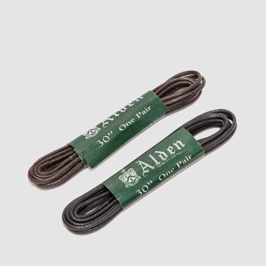 Two pairs of Alden Madison Lace - Shoe Lace, 30 Inch, dark brown round wax laces—ideal for 5-6 eyelet shoes—are coiled and wrapped in green bands labeled “Alden 30 One Pair” on a plain light gray background.