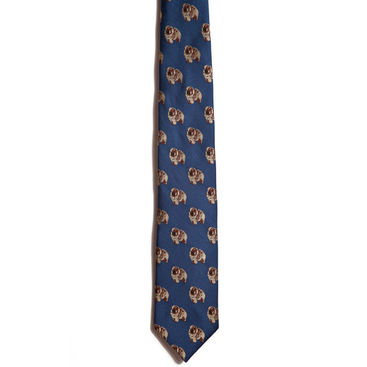 The Alden Madison Chow Chow is a blue silk jacquard necktie adorned with a pattern of detailed brown and beige dog faces—an ideal addition to any dog breed necktie collection.