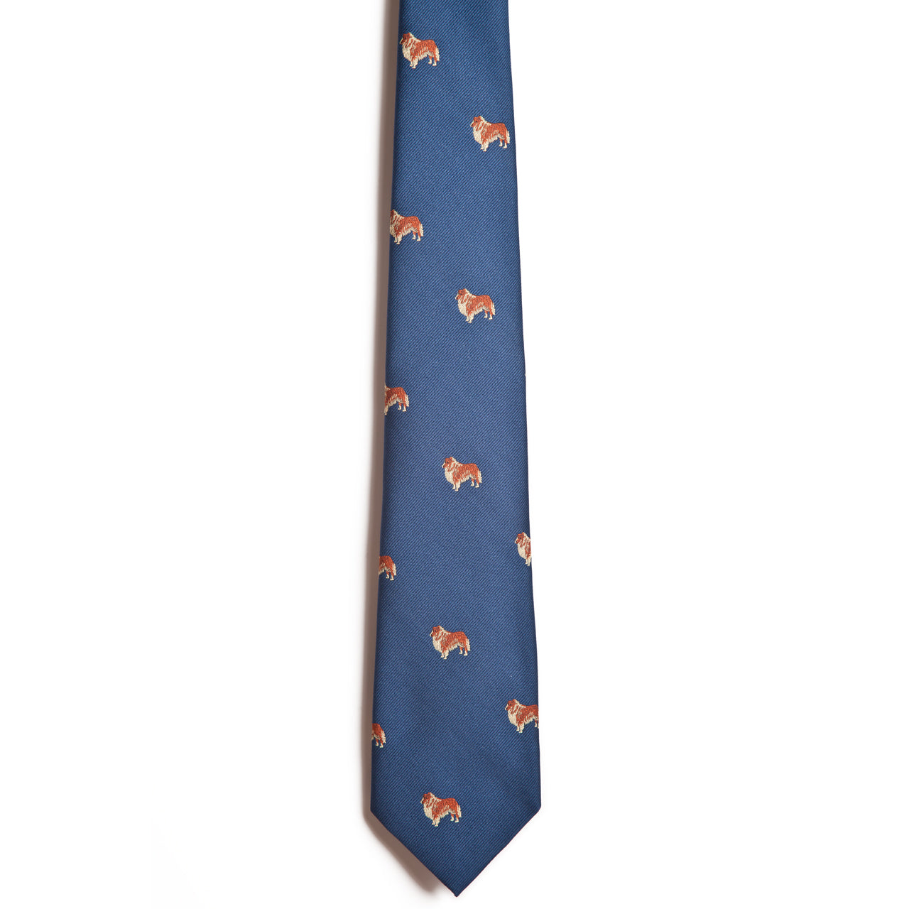 The Alden Madison Collie is a blue silk necktie featuring a pattern of small, repeating brown and white bulldogs.
