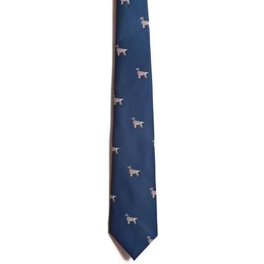 The Alden Madison English Setter tie is navy blue silk with a repeating pattern of small, light-colored embroidered English Setters, shown on a white background.