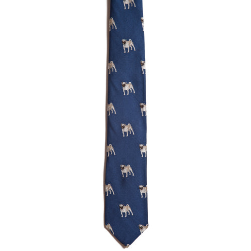 The Alden Madison Pug necktie is a blue silk tie with small beige and brown pug illustrations—an ideal addition to any dog breed necktie collection.