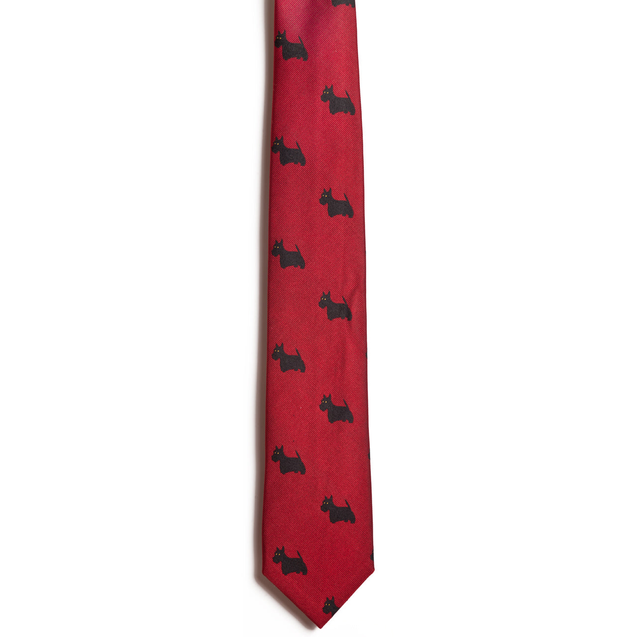 The Alden Madison Scottish Terrier necktie is crafted from 100% silk and features a jacquard pattern of black Scottish Terrier silhouettes on a white background.