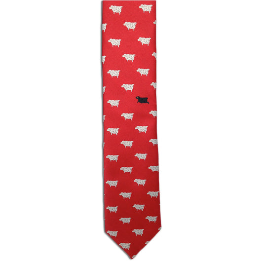 The Black Sheep necktie from Alden Madison features a vintage design with playful, evenly distributed white sheep motifs and one black sheep, creating a whimsical contrast that makes it a standout novelty tie.